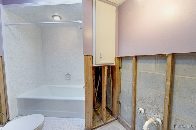 bathroom with toilet and a bath