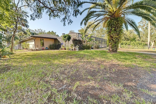 view of yard with a lanai