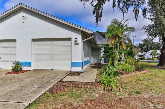 view of side of home featuring a garage