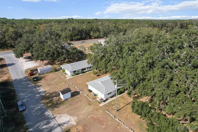 9445 W Milwaukee Ct, Crystal River, FL 34428 - aerial view of property and surrounding area featuring a heavily wooded area