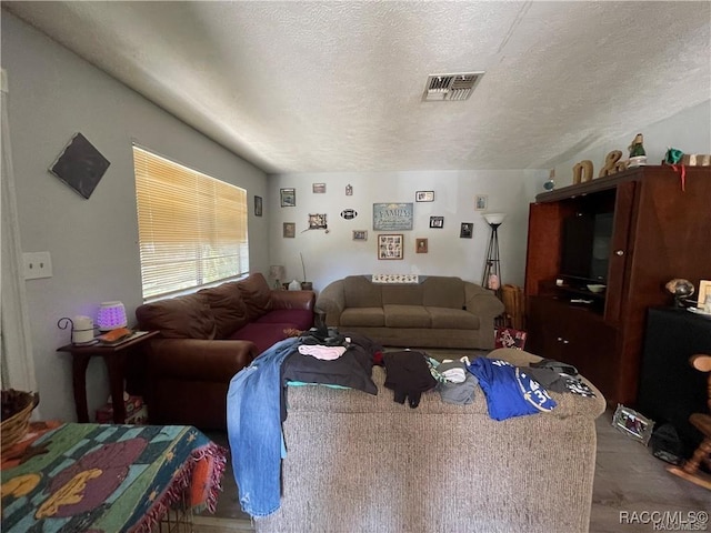 9445 W Milwaukee Ct, Crystal River, FL 34428 - living area with a textured ceiling