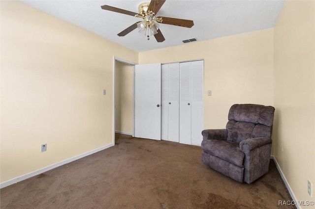 9445 W Milwaukee Ct, Crystal River, FL 34428 - sitting room with carpet floors, ceiling fan, and baseboards