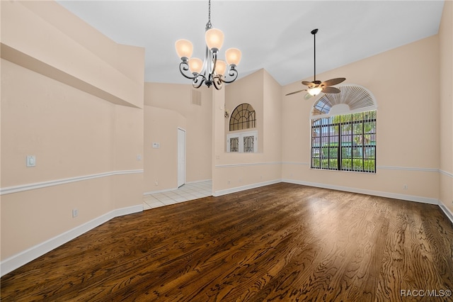 interior space featuring lofted ceiling, light hardwood / wood-style floors, and ceiling fan with notable chandelier