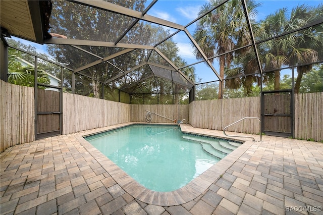 view of pool featuring a lanai and a patio area