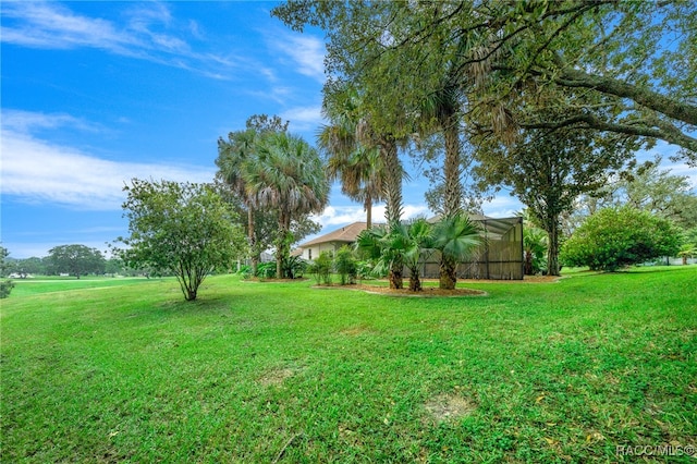 view of yard with a lanai