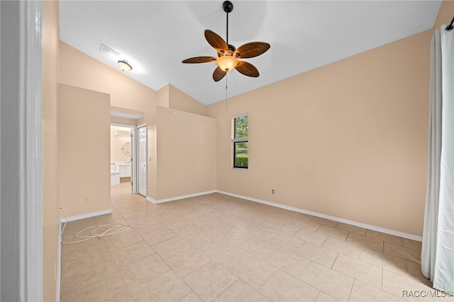 tiled empty room with ceiling fan and lofted ceiling