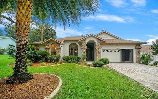 ranch-style house with a garage and a front lawn