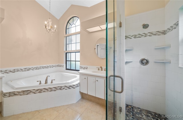 bathroom with plus walk in shower, a notable chandelier, tile patterned floors, vaulted ceiling, and vanity