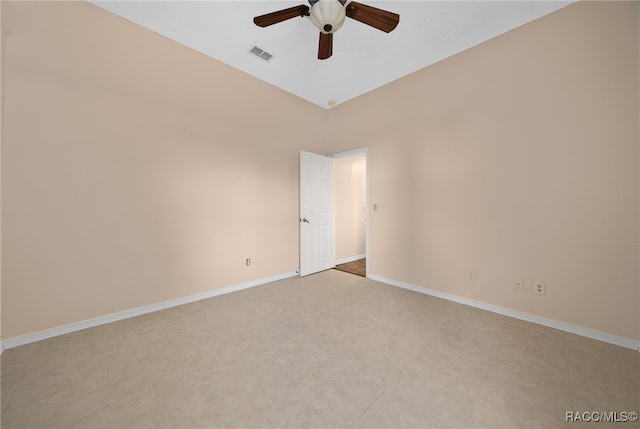 tiled spare room featuring ceiling fan and high vaulted ceiling