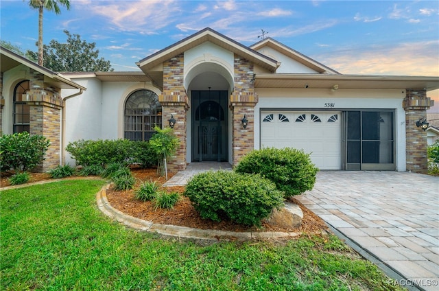 single story home with a garage