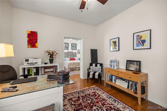 office space with dark hardwood / wood-style floors and ceiling fan