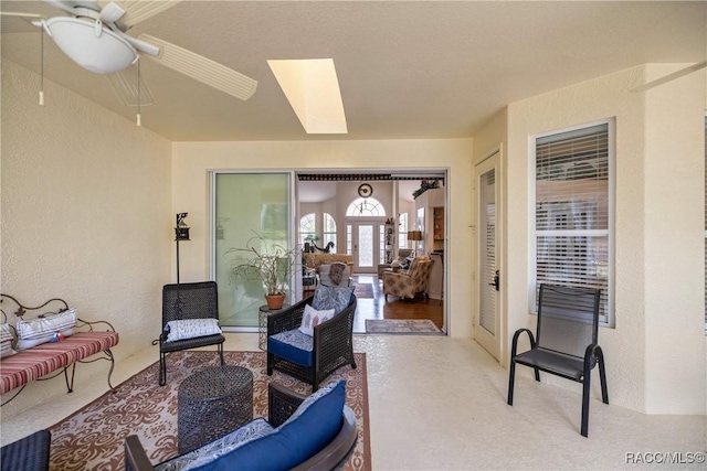 view of patio with ceiling fan and outdoor lounge area