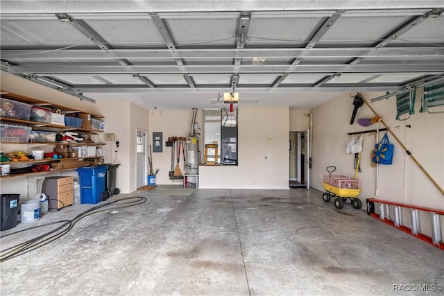 garage featuring a garage door opener, electric panel, heating unit, and gas water heater