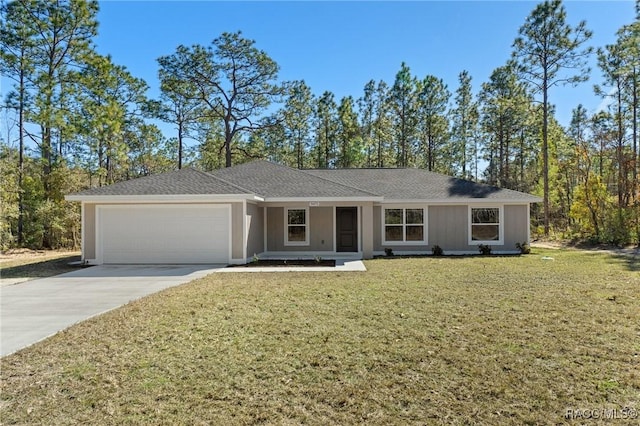 single story home with a garage and a front lawn