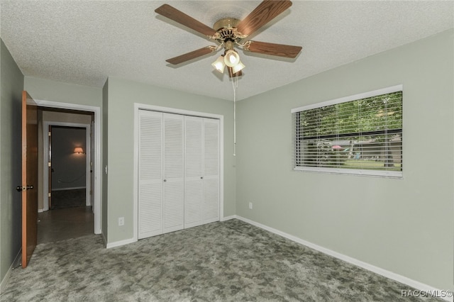 unfurnished bedroom featuring ceiling fan, a closet, carpet, and a textured ceiling