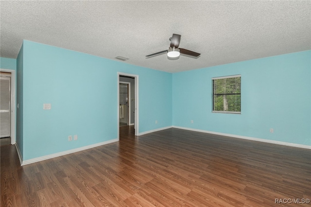 unfurnished room with ceiling fan, dark hardwood / wood-style flooring, and a textured ceiling