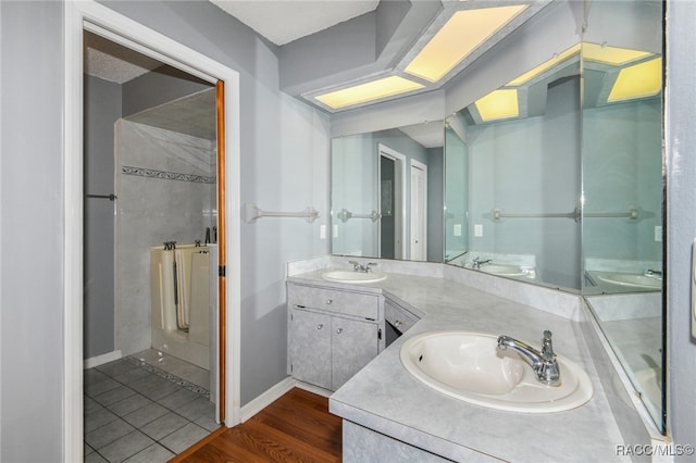 bathroom with vanity and wood-type flooring