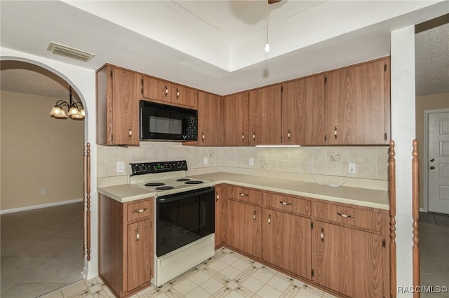 kitchen with a textured ceiling, white electric range, backsplash, and hanging light fixtures