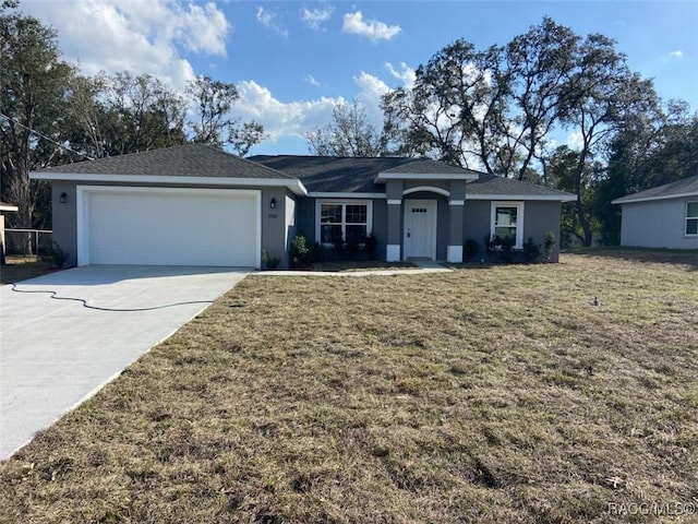 ranch-style house with a garage and a front yard