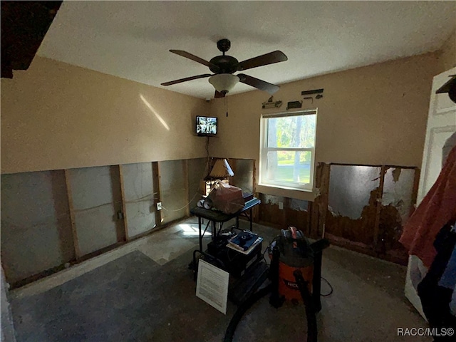 interior space featuring ceiling fan