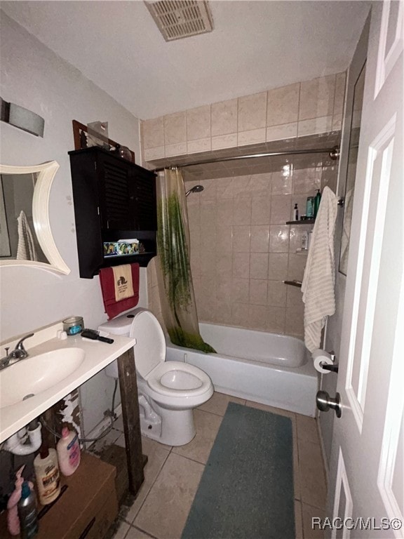 bathroom featuring tile patterned floors, toilet, and shower / tub combo