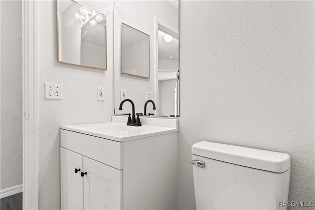 3143 Grayton Dr, Spring Hill, FL 34609 - bathroom with vanity and a textured wall