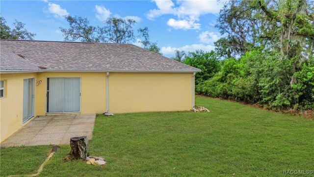 3143 Grayton Dr, Spring Hill, FL 34609 - view of grassy yard featuring a patio area