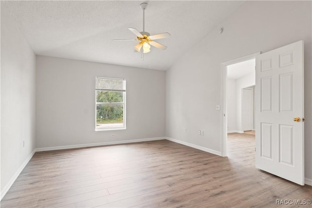 3143 Grayton Dr, Spring Hill, FL 34609 - spare room with a ceiling fan, vaulted ceiling, and wood finished floors
