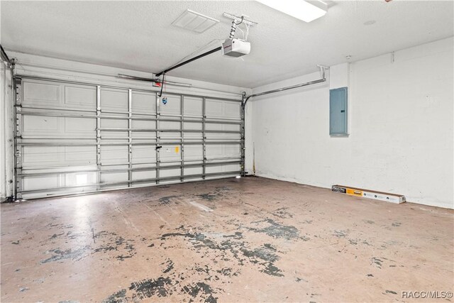 3143 Grayton Dr, Spring Hill, FL 34609 - garage with electric panel and a garage door opener