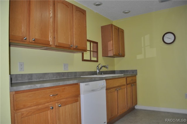 kitchen featuring a textured ceiling, white dishwasher, stainless steel counters, sink, and light tile patterned flooring