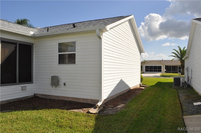 view of home's exterior with a yard