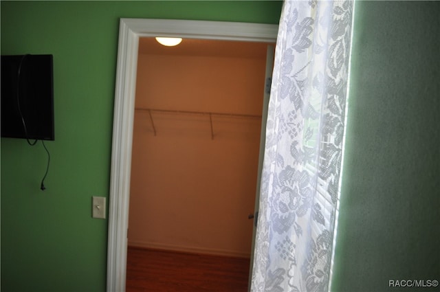 bathroom with hardwood / wood-style floors