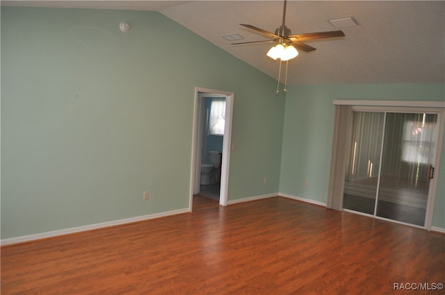 unfurnished room with ceiling fan, dark hardwood / wood-style flooring, and vaulted ceiling