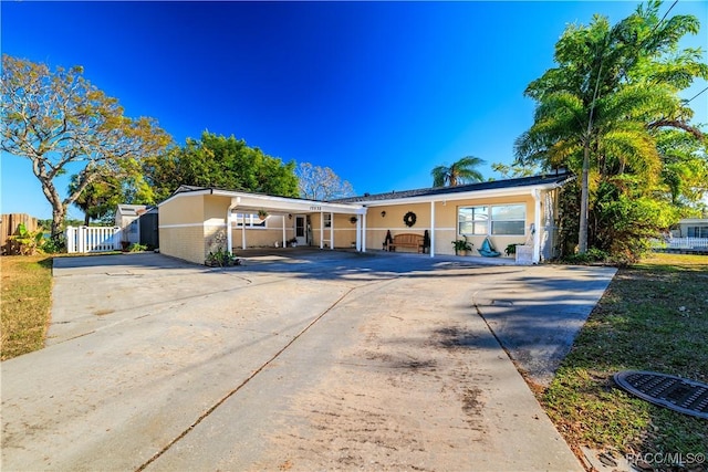 ranch-style house with a carport