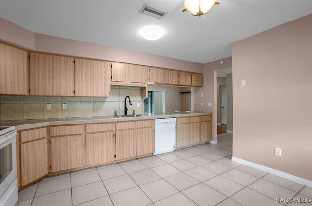 kitchen with sink, light brown cabinets, tasteful backsplash, white appliances, and light tile patterned floors