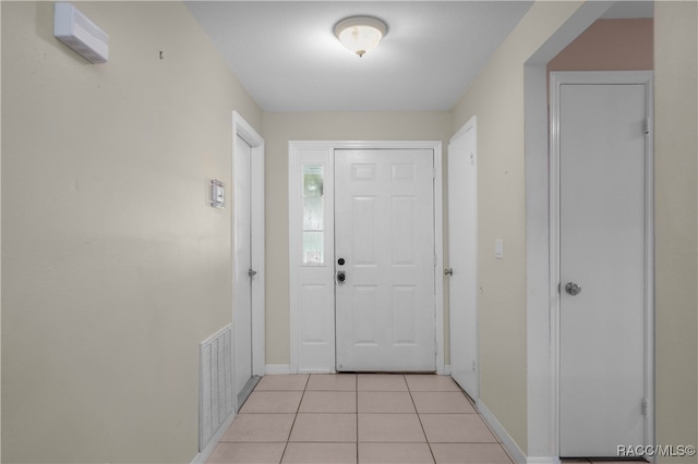 doorway featuring light tile patterned floors