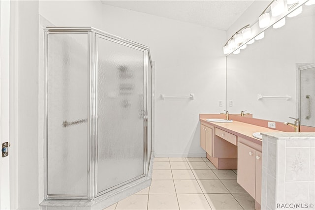 bathroom featuring vanity, lofted ceiling, tile patterned flooring, a textured ceiling, and an enclosed shower