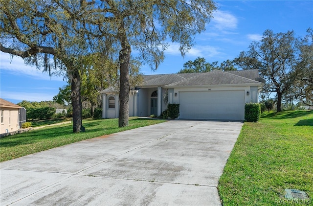 ranch-style home with a front yard and a garage