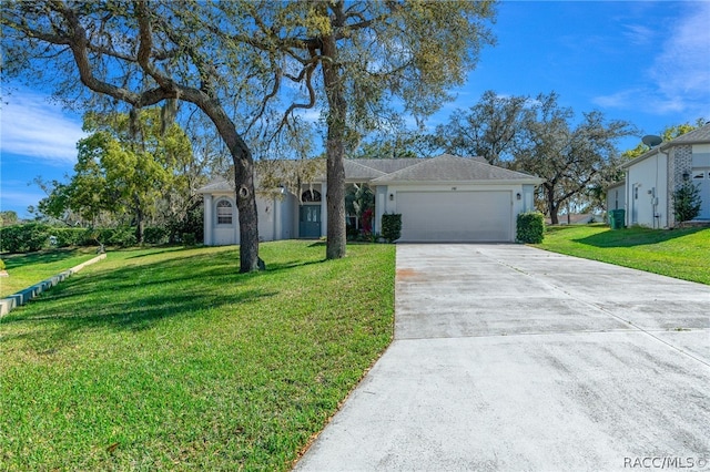 ranch-style house featuring a garage and a front lawn