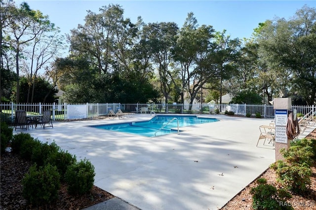 view of swimming pool featuring a patio