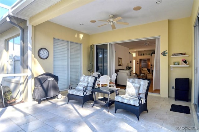 view of patio featuring ceiling fan and a grill