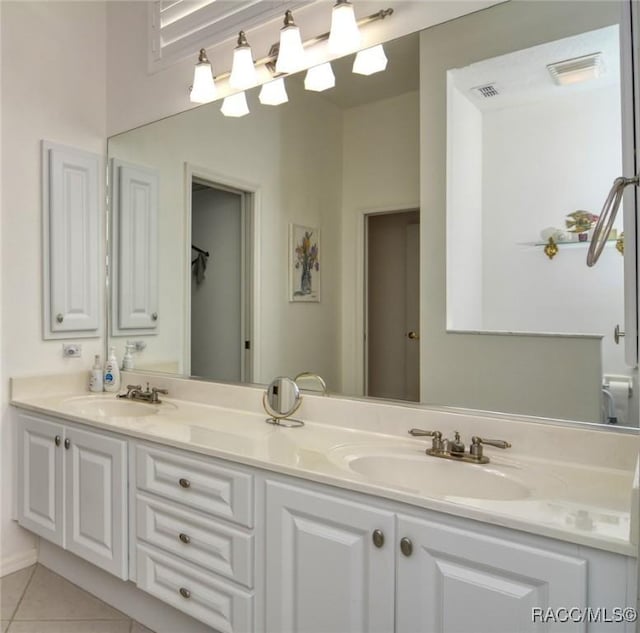 bathroom featuring tile patterned floors and vanity