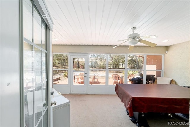 sunroom / solarium featuring ceiling fan and plenty of natural light