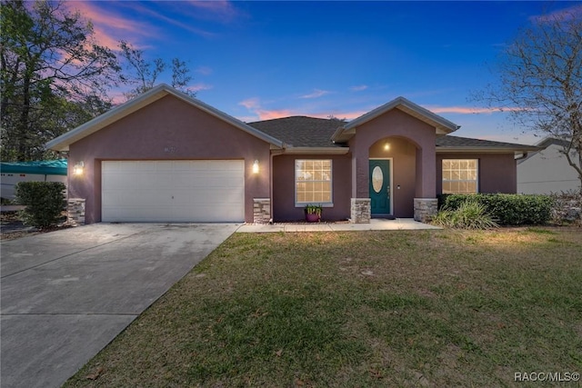 ranch-style home featuring driveway, a front yard, an attached garage, stucco siding, and stone siding