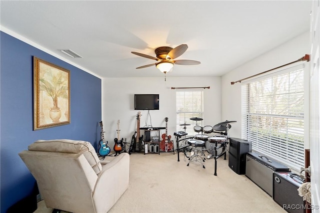 interior space featuring visible vents and ceiling fan