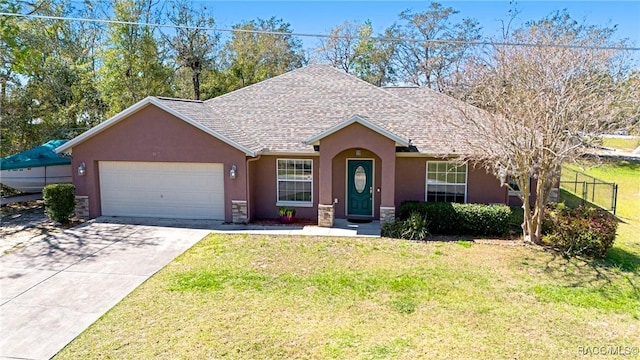 ranch-style home with concrete driveway, an attached garage, stucco siding, and a front yard