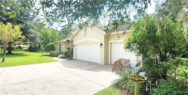 view of front of property with a front lawn and a garage