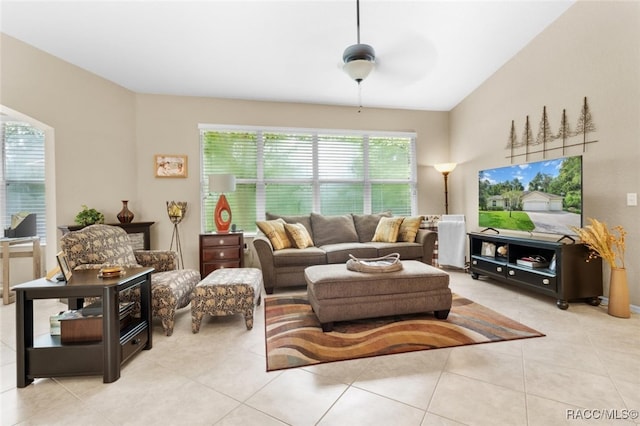 living room featuring ceiling fan and light tile patterned floors