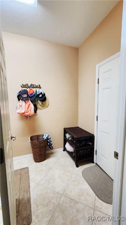 interior space with tile patterned floors