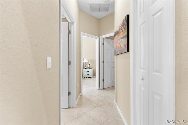 hallway featuring light tile patterned flooring